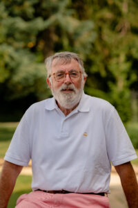 man in front of trees