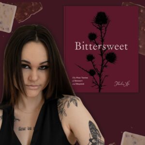 tattooed woman with book titled bittersweet